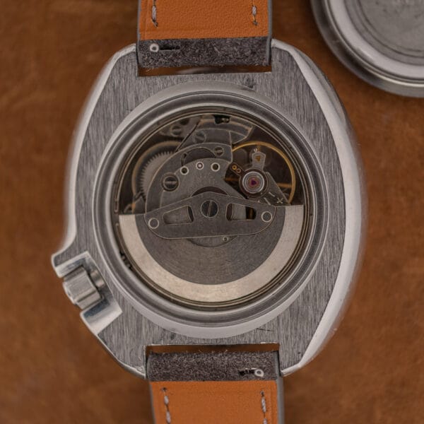 Seiko 6105B automatic movement in the open 6105-8119 case, rotor and bridges clean with light handling wear
