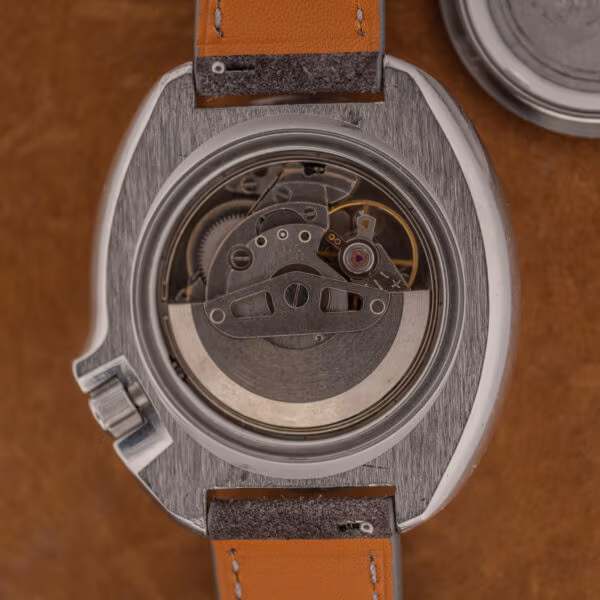 Seiko 6105B automatic movement in the open 6105-8119 case, rotor and bridges clean with light handling wear