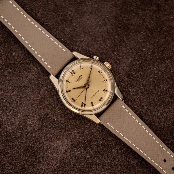 Vintage Vulcain Cricket wristwatch, cream champagne dial with fine hairline crazing, round gold capped case