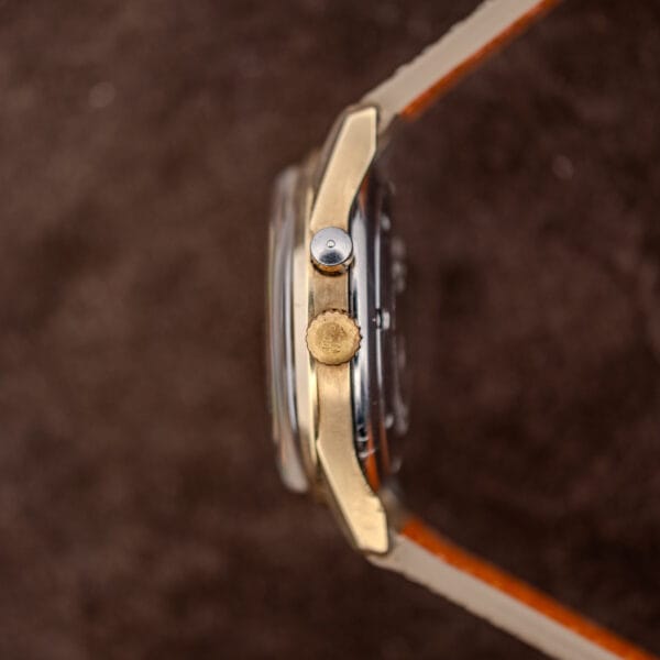 Vulcain Cricket case profile with signed crown, alarm pusher above it, and high domed acrylic crystal
