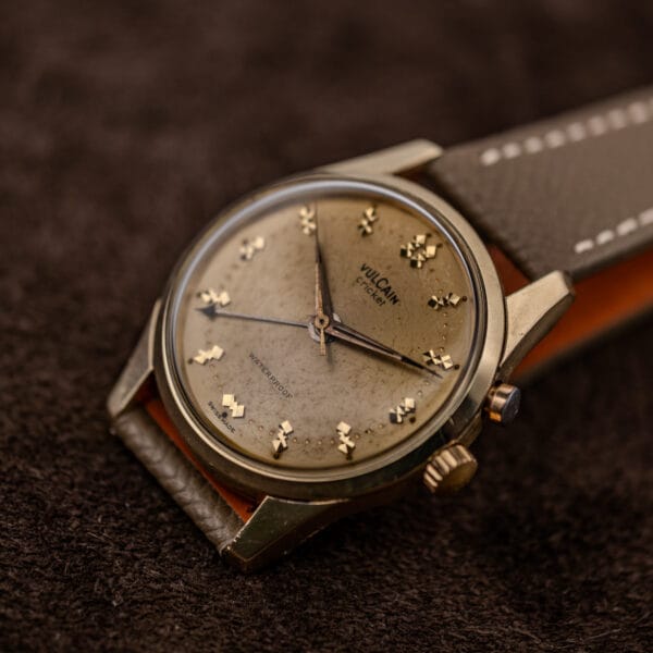 Vulcain Cricket 307004 dial with widespread crazing and spotting, dark central seconds hand, taupe strap