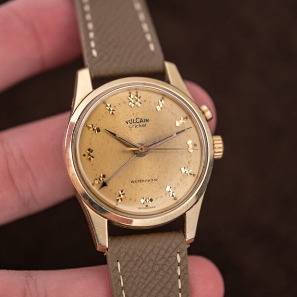 Vulcain Cricket alarm wristwatch on taupe Saffiano leather strap, gold capped case with honest wear