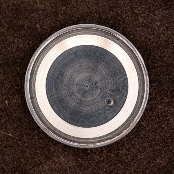 Interior of the Vulcain Cricket caseback, concentric machining and handwritten service or inventory marks, one readable as 6362