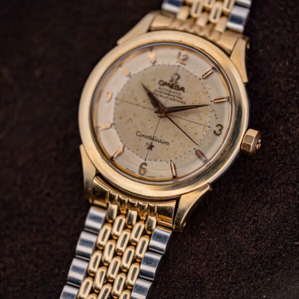 Vintage Omega Constellation twelve-faceted pie-pan dial showing patina across flat centre and sloped outer rim
