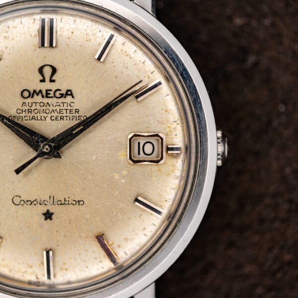 Right side of Omega Constellation 168.004 dial, showing the date aperture, bezel and crown edge