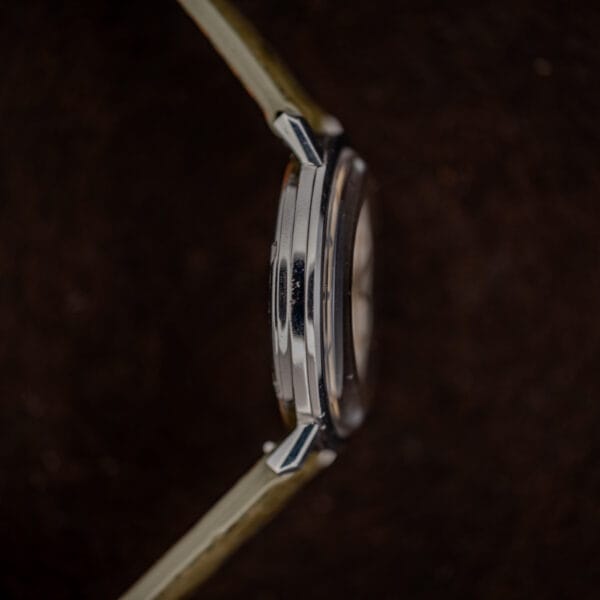 Omega Constellation 168.004 opposite-side profile with smooth case edge, crystal outline and strap ends visible