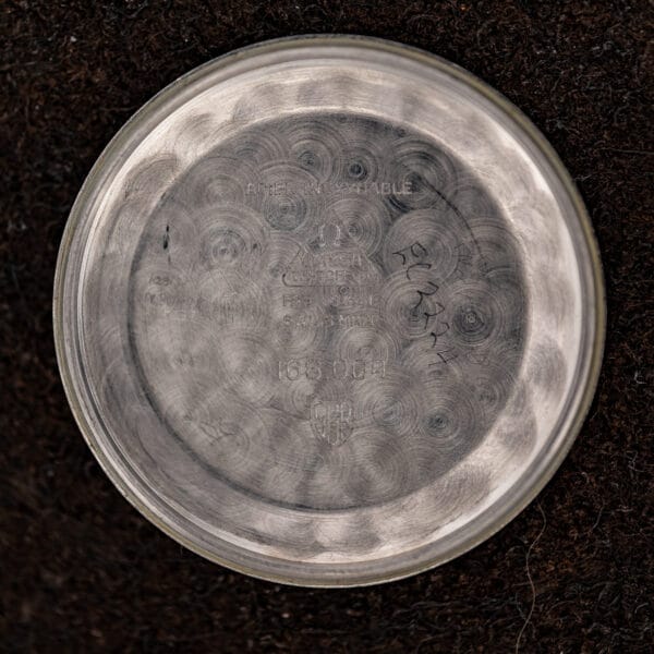 Omega Constellation inner caseback bearing the 168.004 reference, Omega maker stamp and ACIER INOXYDABLE lettering