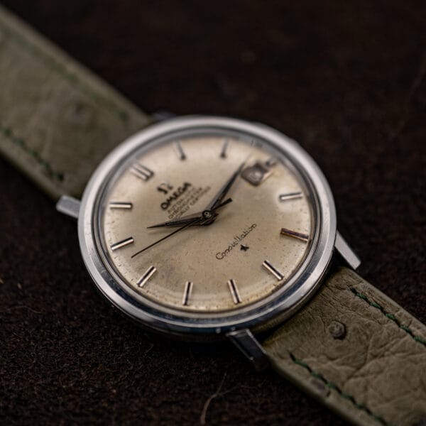Low angled view of Omega Constellation 168.004 showing the lower dial, smooth bezel and straight lugs