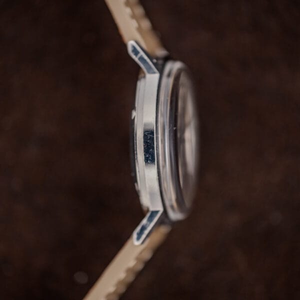 Movado Kingmatic 15161 opposite-side view highlighting the stainless steel case flank, projecting crystal and downward lugs