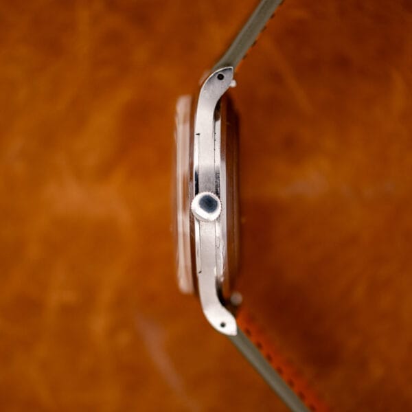 Crown-side profile of the IWC stainless steel case, showing the raised crystal and drilled lugs