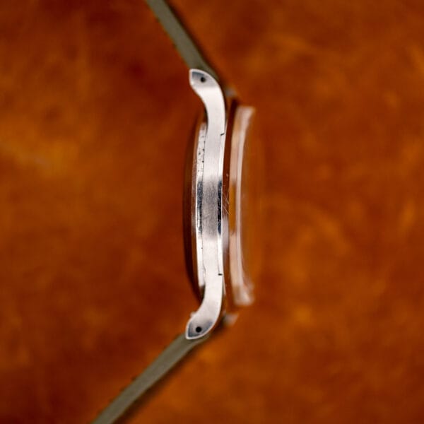 IWC opposite-side profile showing the raised crystal, curved lug shape and drilled lug ends