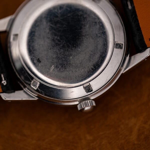 Close-up of Girard Perregaux caseback showing stainless steel inscription and stamped number