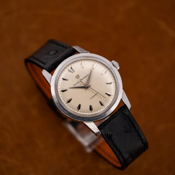 Girard Perregaux Gyromatic on stand showing faceted hands and textured ostrich strap
