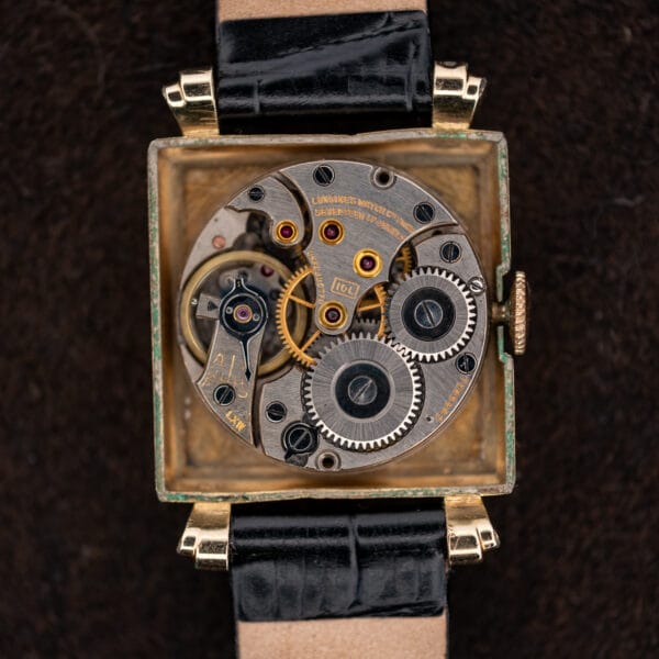 Longines 10L manual winding movement with seventeen jewel inscription inside its square gold filled case