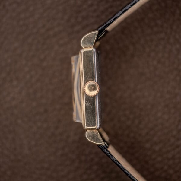 Gruen Precision 335/756 side profile centered on the winding crown, raised crystal and downturned lugs