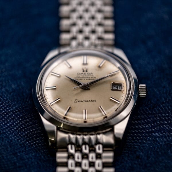 Low frontal view of Omega Seamaster 168.024 emphasizing the lower lugs, silver dial and beads-of-rice bracelet