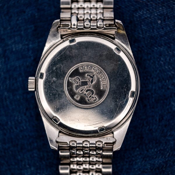 Omega Seamaster 168.024 caseback with seahorse medallion, SEAMASTER lettering and attached stainless steel bracelet