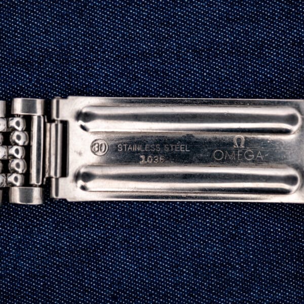 Inside clasp of Omega Seamaster 168.024 bracelet showing OMEGA, STAINLESS STEEL and numbered reference stamp