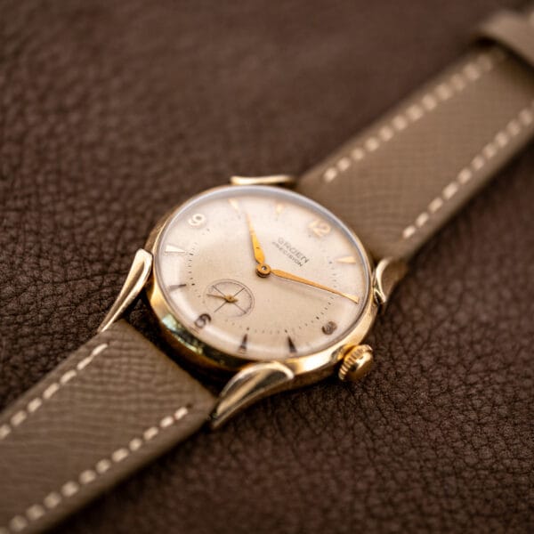 Oblique view of Gruen Precision 415/932 showing the winding crown, raised crystal and sculpted lugs