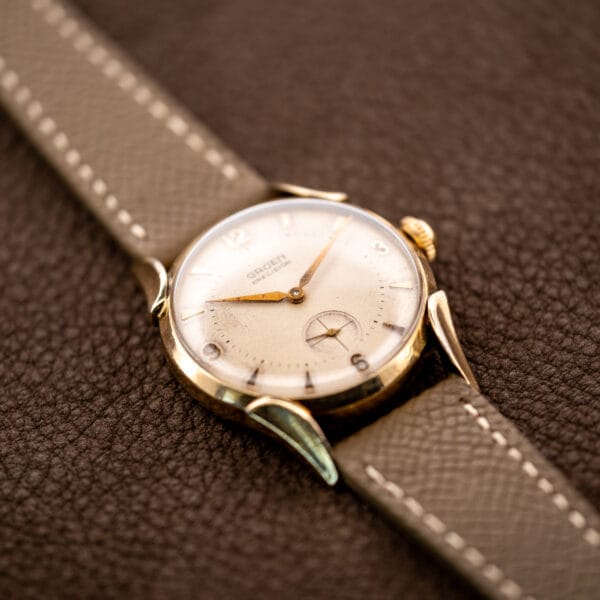 Gruen Precision 415/932 viewed from below the dial, emphasizing the sweeping lower lugs and small seconds
