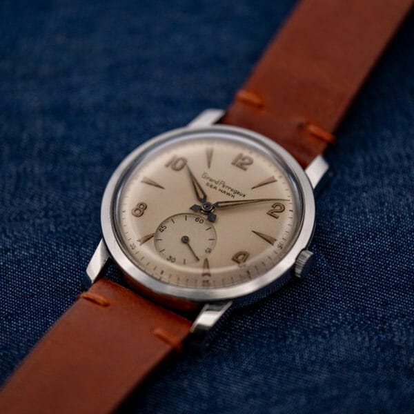 Oblique view of Girard Perregaux Sea Hawk showing the dial, winding crown and brown leather strap