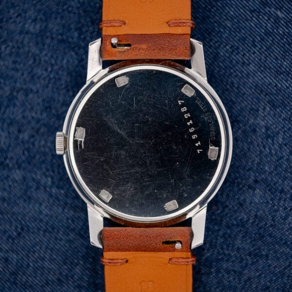 Girard Perregaux Sea Hawk caseback with numbered marking, stainless steel lettering and leather strap undersides