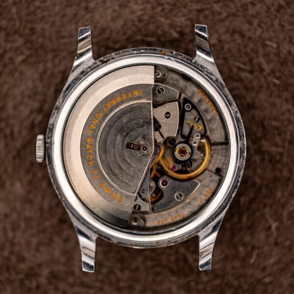 Open IWC automatic case displaying semicircular rotor signed International Watch Company Swiss
