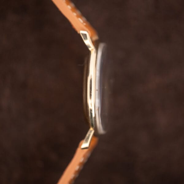 Opposite-side Hamilton Masterpiece profile highlighting the narrow case edge, projecting crystal and downward-curving lugs