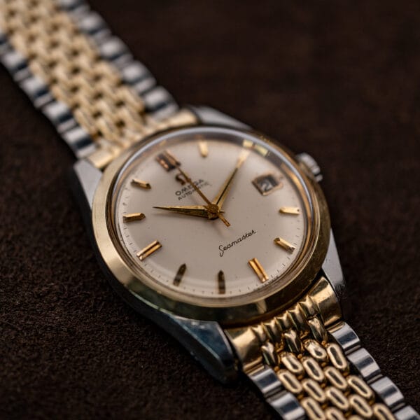 Low front view of Omega Seamaster 14744-1 highlighting the lower lugs, bracelet end links and dial script