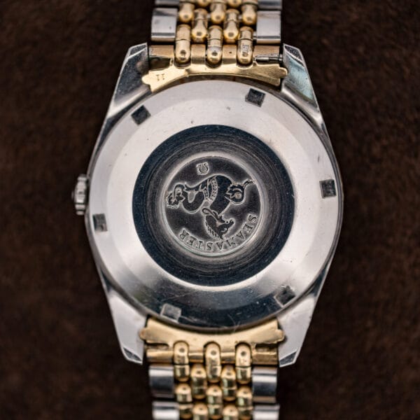 Omega Seamaster 14744-1 caseback with the seahorse emblem, Seamaster lettering and six perimeter opening notches