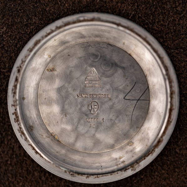 Inner caseback of Omega Seamaster 14744-1 with Omega triangle, ACIER STAYBRITE lettering and stamped reference number