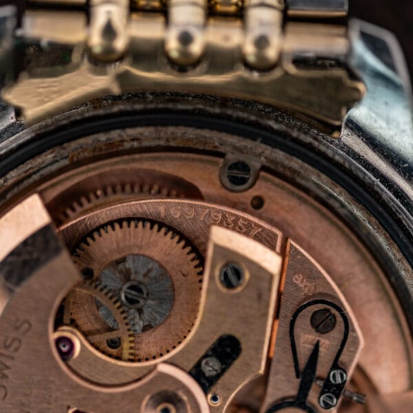 Omega Seamaster 14744-1 movement detail showing the numbered bridge, winding gears and regulator assembly