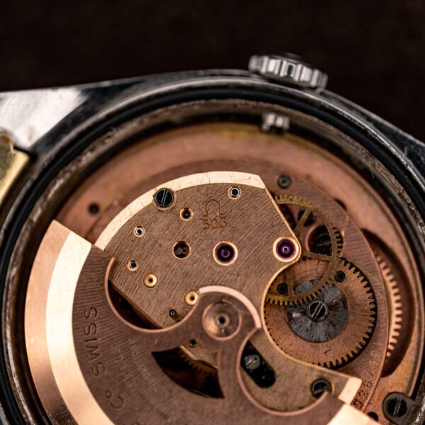 Close-up of Omega caliber 503 showing its stamped caliber number, jeweled bridge and automatic winding mechanism