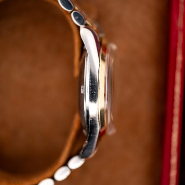 Opposite-side profile of Omega Seamaster 14744-1 showing curved lugs and the crystal above its gold bezel