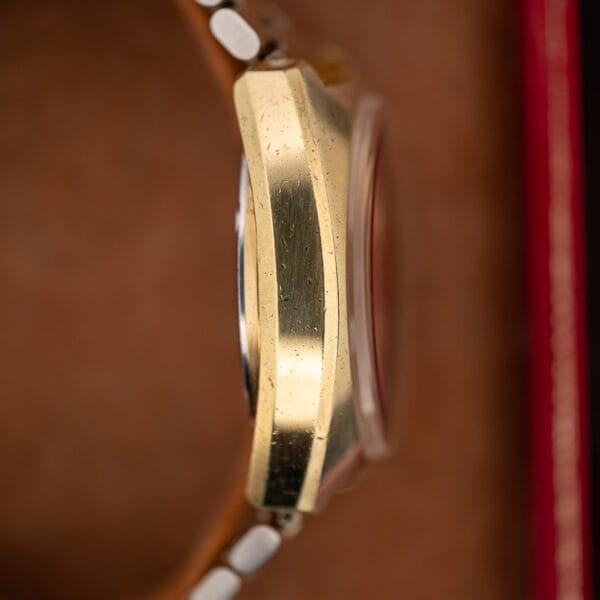 Opposite-side profile of Omega Memomatic 166.072 showing the smooth case flank, raised crystal and caseback outline