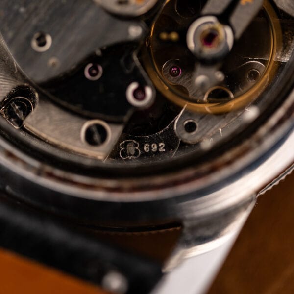 Glycine Airman movement macro showing the stamped 692 caliber number beside the balance and jeweled components