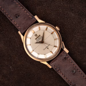 Omega Constellation 167.005 with silver crosshair pie pan dial, rose gold capped case, and brown ostrich strap