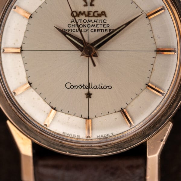 Lower Omega Constellation 167.005 dial showing crosshair lines, applied star, dauphine hands, and Swiss markings