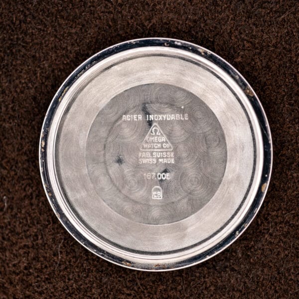 Inner caseback of Omega Constellation 167.005 stamped ACIER INOXYDABLE with Omega and C.B markings