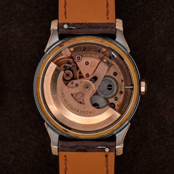 Omega Constellation 167.005 with caseback removed, revealing its caliber 551 automatic movement and signed rotor