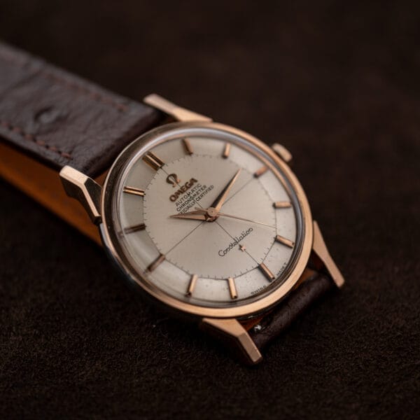 Silver dial of Omega Constellation 167.005 seen obliquely with crosshairs, star, and chronometer signature