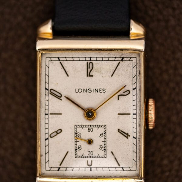Longines dial close-up showing elongated Arabic numerals, a rectangular minute track and square subsidiary seconds
