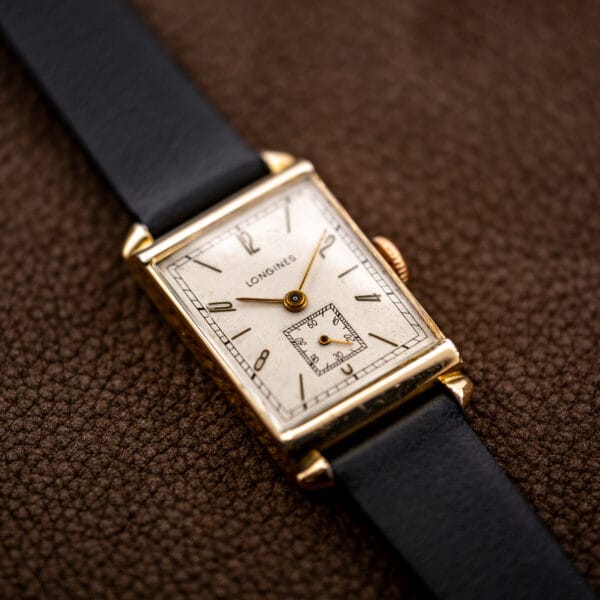 Angled Longines tank viewed from the lower lugs, with slim hands and small seconds in view