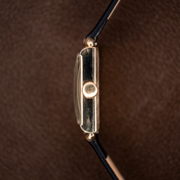 Longines tank crown-side profile showing the winding crown, raised crystal and drilled lug ends
