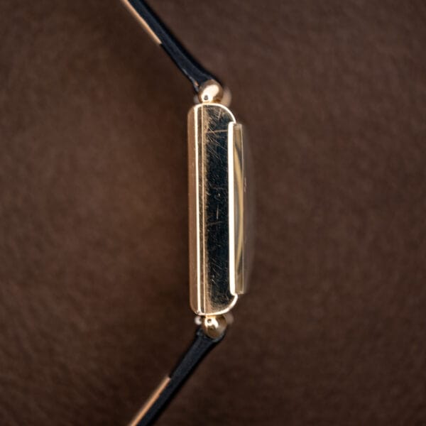 Opposite-side profile of the Longines rectangular case, showing its crystal edge and curved lug ends