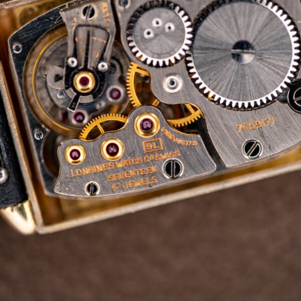 Longines caliber 9L close-up with the 17 JEWELS inscription, signed bridge and visible balance