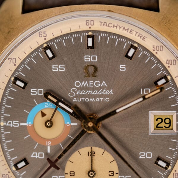 Upper dial detail of Omega 176.007 showing Seamaster signature, applied markers, and contrasting tachymeter scale