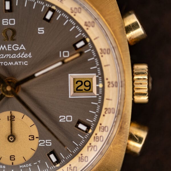 Date window and chronograph pushers beside the mocha dial of Omega Seamaster reference 176.007