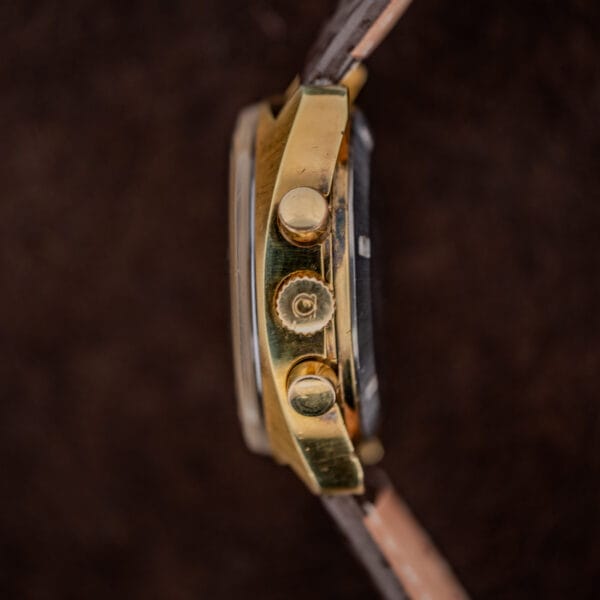 Omega signed crown between two round chronograph pushers on the side of Seamaster reference 176.007