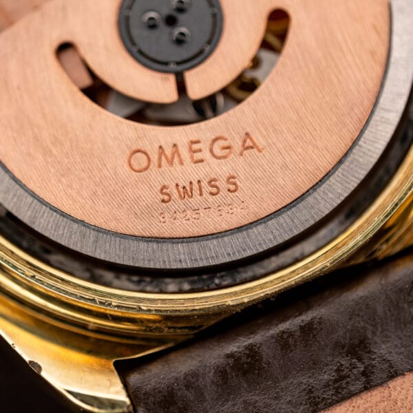 Close view of Omega Seamaster 176.007 rotor engraved OMEGA SWISS with movement serial beneath